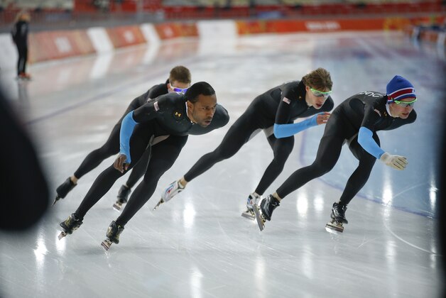 U.S. speedskaters Joey Mantia, rear left, Shani davis, front left, Brian Hansen, second right, and Jonathan Kuck, right, practice for the team pursuit at Adler Arena Skating Center during the 2014 Winter Olympics, Monday, Feb. 17, 2014, in Sochi, Russia. (AP Photo/Pavel Golovkin)