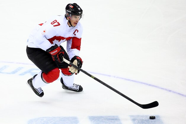 SOCHI, RUSSIA - FEBRUARY 19:  Sidney Crosby #87 of Canada controls the puck against Latvia during the Men's Ice Hockey Quarterfinal Playoff on Day 12 of the 2014 Sochi Winter Olympics at Bolshoy Ice Dome on February 19, 2014 in Sochi, Russia.  (Photo by Streeter Lecka/Getty Images)