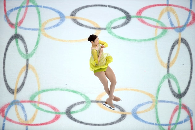 SOCHI, RUSSIA - FEBRUARY 19:  (Editors Note: Image was created using multiple exposure in camera) Yuna Kim of South Korea competes in the Figure Skating Ladies' Short Program on day 12 of the Sochi 2014 Winter Olympics at Iceberg Skating Palace on February 19, 2014 in Sochi, Russia.  (Photo by Ryan Pierse/Getty Images)