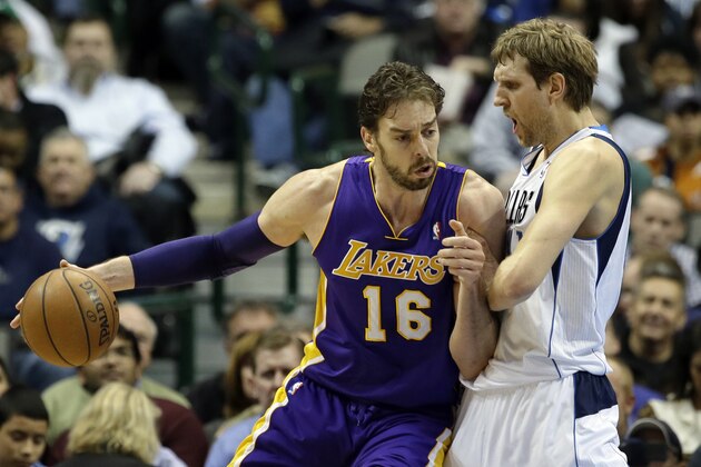 Los Angeles Lakers' Pau Gasol (16) of Spain fights for an opening to the basket against Dallas Mavericks' Dirk Nowitzki of Germany, right, in the second half of an NBA basketball game, Tuesday, Jan. 7, 2014, in Dallas. The Mavericks won 110-97. (AP Photo/Tony Gutierrez)