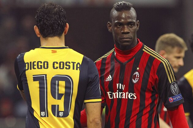 MILAN, ITALY - FEBRUARY 19:  Mario Balotelli (R) of AC Milan and Diego Costa of Club Atletico de Madrid look on during the UEFA Champions League Round of 16 match between AC Milan and Club Atletico de Madrid at Stadio Giuseppe Meazza on February 19, 2014 in Milan, Italy.  (Photo by Marco Luzzani/Getty Images)