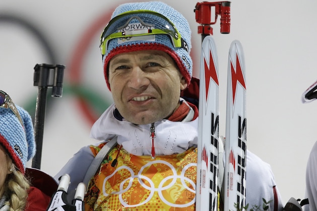 Norway's Ole Einar Bjoerndalen smiles after winning the gold during the mixed biathlon relay at the 2014 Winter Olympics, Wednesday, Feb. 19, 2014, in Krasnaya Polyana, Russia. (AP Photo/Lee Jin-man)