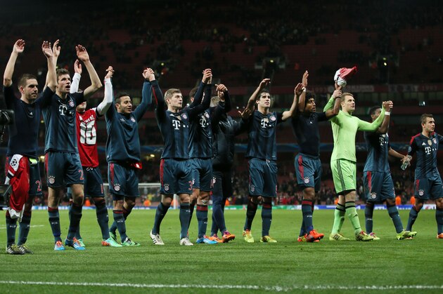 Munich players celebrate after a Champions League, round of 16, first leg soccer match between Arsenal and Bayern Munich at the Emirates stadium in London, Wednesday, Feb. 19, 2014 .(AP Photo/Alastair Grant)