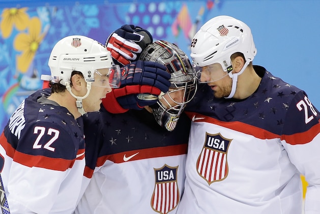 USA defenseman Kevin Shattenkirk, goaltender Jonathan Quick and forward Blake Wheeler celebrate their 5-2 win over the Czech Republic after the men's quarterfinal hockey game in Shayba Arena at the 2014 Winter Olympics, Wednesday, Feb. 19, 2014, in Sochi, Russia. (AP Photo/David J. Phillip )