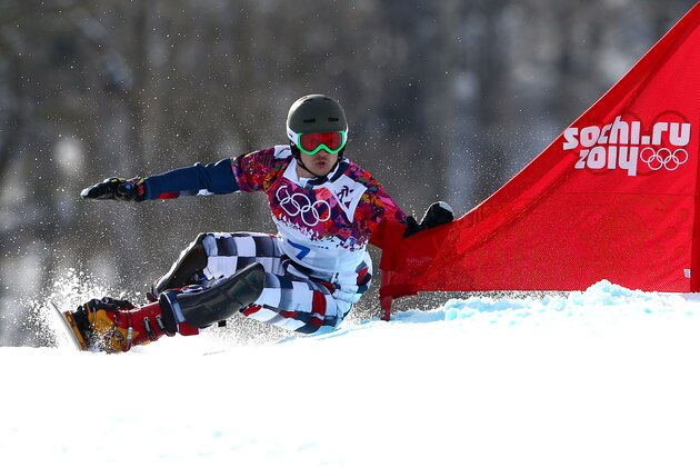 SOCHI, RUSSIA - FEBRUARY 19:  Vic Wild of Russia competes in the Snowboard Men's Parallel Giant Slalom Finals on day twelve of the 2014 Winter Olympics at Rosa Khutor Extreme Park on February 19, 2014 in Sochi, Russia.  (Photo by Cameron Spencer/Getty Images)