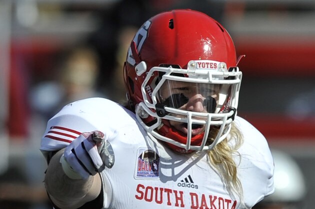 South Dakota's Tyler Starr (11), yells to teammates during the first half of an NCAA football game against Illinois State in Normal, Ill., Saturday, Oct. 26, 2013. (AP Photo/Paul Beaty)