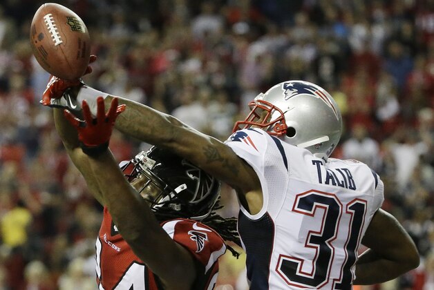 New England Patriots cornerback Aqib Talib (31) breaks up a pass intended for Atlanta Falcons wide receiver Roddy White (84) during the second half of an NFL football game, Sunday, Sept. 29, 2013, in Atlanta. The New England Patriots won 30-23. (AP Photo/David Goldman)