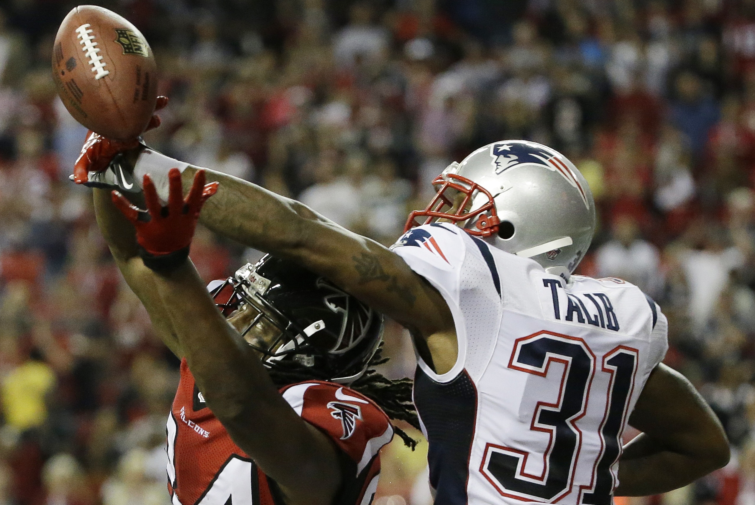 New England Patriots cornerback Aqib Talib (31) breaks up a pass intended for Atlanta Falcons wide receiver Roddy White (84) during the second half of an NFL football game, Sunday, Sept. 29, 2013, in Atlanta. The New England Patriots won 30-23. (AP Photo/David Goldman)