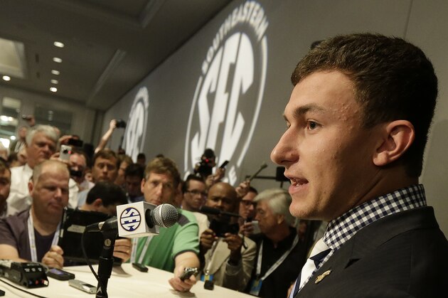 ADVANCE FOR WEEKEND EDITIONS, AUG. 17-18 - FILE - In this July 17, 2013 file photo, Texas A&M quarterback Johnny Manziel talks with reporters during the Southeastern Conference football Media Days in Hoover, Ala. Allegations that he received payment for autographs could threaten his eligibility along with A&M's season and have some in College Station fed up with his antics.   (AP Photo/Dave Martin, File)