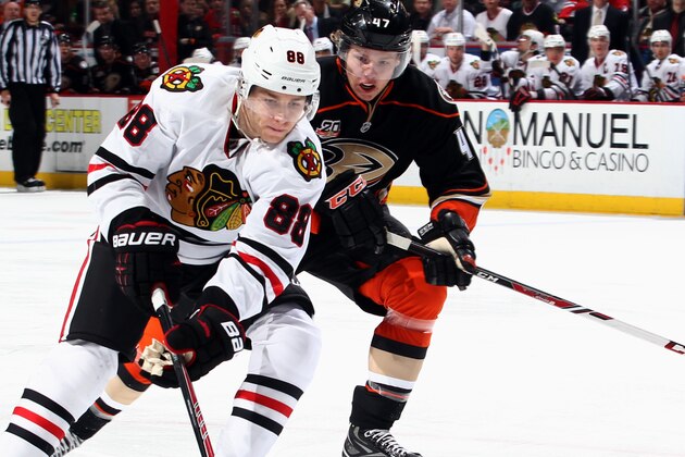ANAHEIM, CA - FEBRUARY 5:  Patrick Kane #88 of the Chicago Blackhawks controls the puck against Hampus Lindholm #47 of the Anaheim Ducks on February 5, 2014 at Honda Center in Anaheim, California. (Photo by Debora Robinson/NHLI via Getty Images)