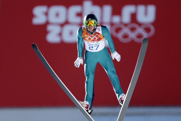 United States' Bill Demong makes his trial jump during the ski jumping portion of the Nordic combined at the 2014 Winter Olympics, Wednesday, Feb. 12, 2014, in Krasnaya Polyana, Russia. (AP Photo/Matthias Schrader)
