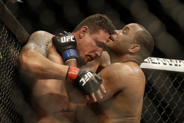Daniel Cormier, right, fights Frank Mir during a UFC heavyweight mixed martial arts fight in San Jose, Calif., Saturday, April 20, 2013. Cormier won by unanimous decision. (AP Photo/Jeff Chiu)