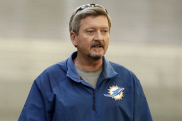 Miami Dolphins general manager Jeff Ireland, left, stands with head trainer Kevin O'Neill, right, during the NFL football team's practice Wednesday, Nov. 6, 2013, in Davie, Fla. (AP Photo/Lynne Sladky)