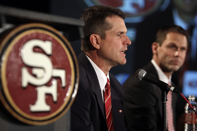 Jim Harbaugh, left, answers a question as San Francisco 49ers general manager Trent Baalke looks on during a news conference, Friday, Jan. 7, 2011, in San Francisco, introducing Harbaugh as the new head coach of the NFL football team. (AP Photo/Ben Margot)