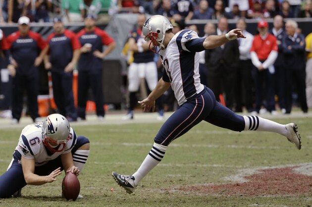 New England Patriots' Stephen Gostkowski, right, kicks a field goal as Ryan Allen (6) holds to take the lead during the fourth quarter of an NFL football game against the Houston Texans, Sunday, Dec. 1, 2013, in Houston. (AP Photo/David J. Phillip)