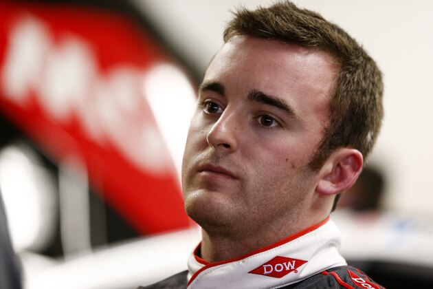 DAYTONA BEACH, FL - FEBRUARY 19:  Austin Dillon, driver of the #3 DOW Chevrolet, stands in the garage area during practice for the NASCAR Sprint Cup Series Daytona 500 at Daytona International Speedway on February 19, 2014 in Daytona Beach, Florida.  (Photo by Brian Lawdermilk/Getty Images)