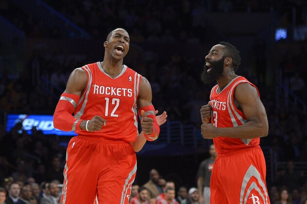 Houston Rockets center Dwight Howard, left, and guard James Harden reacts after Howard was called for a technical foul during the first half of an NBA basketball game against the Los Angeles Lakers, Wednesday, Feb. 19, 2014, in Los Angeles. (AP Photo/Mark J. Terrill)