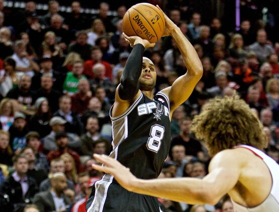 Feb 19, 2014; Portland, OR, USA; San Antonio Spurs point guard Patty Mills (8) shoots against the Portland Trail Blazers during the fourth quarter at the Moda Center. Mandatory Credit: Craig Mitchelldyer-USA TODAY Sports