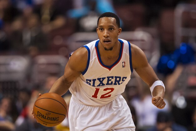 Feb 5, 2014; Philadelphia, PA, USA; Philadelphia 76ers guard Evan Turner (12) brings the ball up court during the fourth quarter against the Boston Celtics at the Wells Fargo Center. The Celtics defeated the Sixers 114-108. Mandatory Credit: Howard Smith-USA TODAY Sports