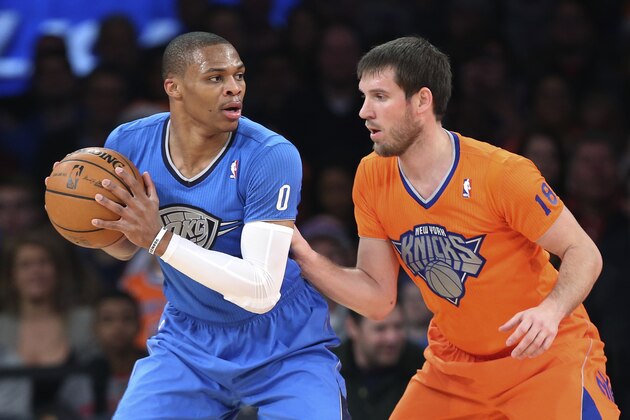 Oklahoma City Thunder point guard Russell Westbrook (0) looks to pass around New York Knicks point guard Beno Udrih (18) during the first half of an NBA basketball game at Madison Square Garden, Wednesday, Dec. 25, 2013, in New York. The Thunder won 123-94. (AP Photo/John Minchillo)