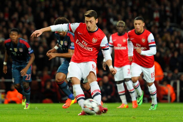 LONDON, ENGLAND - FEBRUARY 19:  Mesut Oezil of Arsenal misses from the penalty spot during the UEFA Champions League Round of 16 first leg match between Arsenal and FC Bayern Muenchen at Emirates Stadium on February 19, 2014 in London, England.  (Photo by Shaun Botterill/Getty Images)