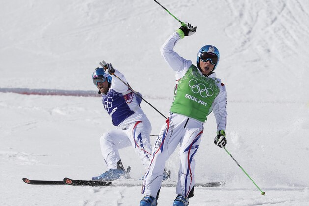 France's Jean Frederic Chapuis, right, celebrates after crossing the line to win the gold medal in the  men's ski cross final at the Rosa Khutor Extreme Park, at the 2014 Winter Olympics, Thursday, Feb. 20, 2014, in Krasnaya Polyana, Russia. At left is silver medalist Arnaud Bovolenta, also of France.  (AP Photo/Andy Wong)