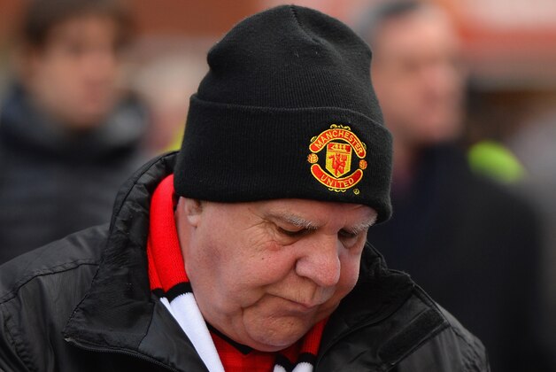 MANCHESTER, ENGLAND - FEBRUARY 09:  A fan enjoys a portion of chips prior to the Barclays Premier League match between Manchester United and Fulham at Old Trafford on February 9, 2014 in Manchester, England.  (Photo by Michael Regan/Getty Images)