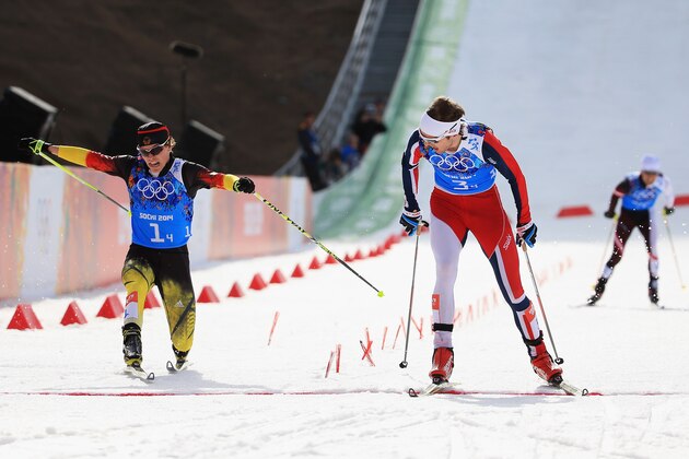 SOCHI, RUSSIA - FEBRUARY 20:  Joergen Graabak of Norway (R) beats Fabian Riessle of Germany in the Nordic Combined Men's Team 4 x 5 km during day 13 of the Sochi 2014 Winter Olympics at RusSki Gorki Jumping Center on February 20, 2014 in Sochi, Russia.  (Photo by Richard Heathcote/Getty Images)
