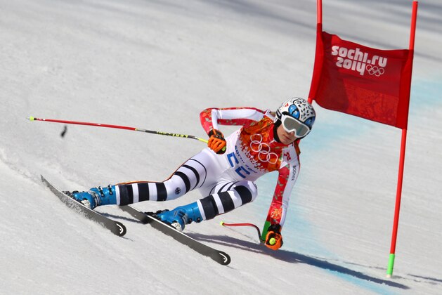 Silver medal winner Maria Hoefl-Riesch of Gemany passes a gate in the women's super-G at the Sochi 2014 Winter Olympics, Saturday, Feb. 15, 2014, in Krasnaya Polyana, Russia. (AP Photo/Alessandro Trovati)