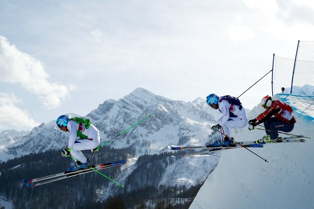 SOCHI, RUSSIA - FEBRUARY 20:  (L-R) Jean Frederic Chapuis of france (green bib), Arnaud Bovolenta of France (blue bib) and Brady Leman of Canada (red bib) compete during the Freestyle Skiing Men's Ski Cross Big Final on day 13 of the 2014 Sochi Winter Olympic at Rosa Khutor Extreme Park on February 20, 2014 in Sochi, Russia.  (Photo by Cameron Spencer/Getty Images)
