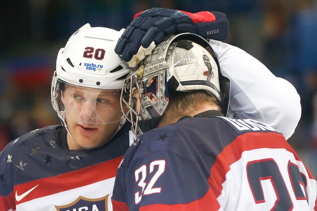 USA defenseman Ryan Suter celebrates Team USA's 5-2 win over the Czech Republic with goaltender Jonathan Quick after the men's quarterfinal hockey game in Shayba Arena at the 2014 Winter Olympics, Wednesday, Feb. 19, 2014, in Sochi, Russia. (AP Photo/Petr David Josek)