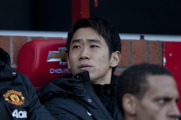 Manchester United's Shinji Kagawa sits on the substitutes bench before his team's English Premier League soccer match against  Fulham at Old Trafford Stadium, Manchester, England, Sunday Feb. 9, 2014. (AP Photo/Jon Super)