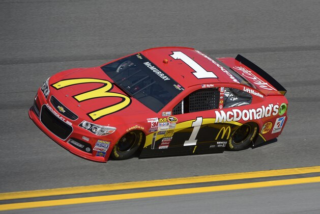 Jamie McMurray (1) drives through Turn 4 during qualifying for the NASCAR Daytona 500 auto race at Daytona International Speedway in Daytona Beach, Fla., Sunday, Feb. 16, 2014. (AP Photo/Phelan M. Ebenhack)