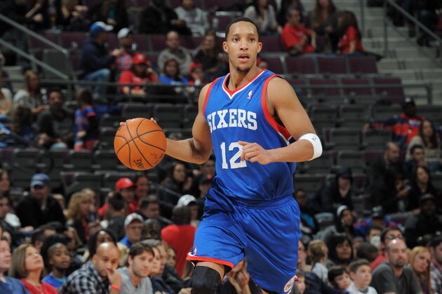 AUBURN HILLS, MI - FEBRUARY 1:  Evan Turner #12 of the Philadelphia 76ers handling the ball during a game against the Detroit Pistons on February 1, 2014 at The Palace of Auburn Hills in Auburn Hills, Michigan. NOTE TO USER: User expressly acknowledges and agrees that, by downloading and/or using this photograph, User is consenting to the terms and conditions of the Getty Images License Agreement.  Mandatory Copyright Notice: Copyright 2014 NBAE (Photo by Allen Einstein/NBAE via Getty Images)
