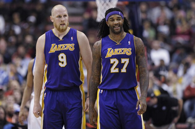 Los Angeles Lakers' Chris Kaman, left, and Jordan Hill are seen during an NBA basketball game against the Philadelphia 76ers on Friday, Feb. 7, 2014, in Philadelphia. The Lakers beat the 76ers 112-98. (AP Photo/Michael Perez)