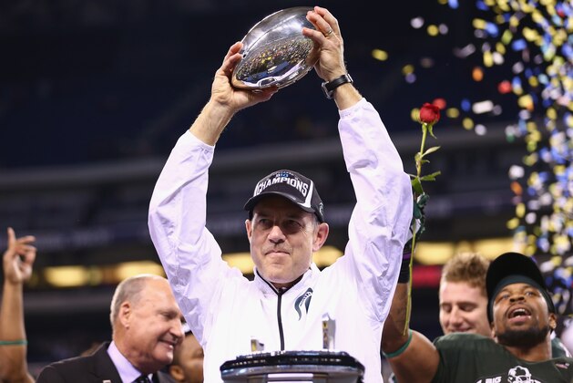 INDIANAPOLIS, IN - DECEMBER 07:  Mark Dantonio the head coach of the Michigan State Spartans holds the champions trophy after Michigan State beat Ohio State Buckeyes 34-24  in the Big Ten Championship at Lucas Oil Stadium on December 7, 2013 in Indianapolis, Indiana.  (Photo by Andy Lyons/Getty Images)
