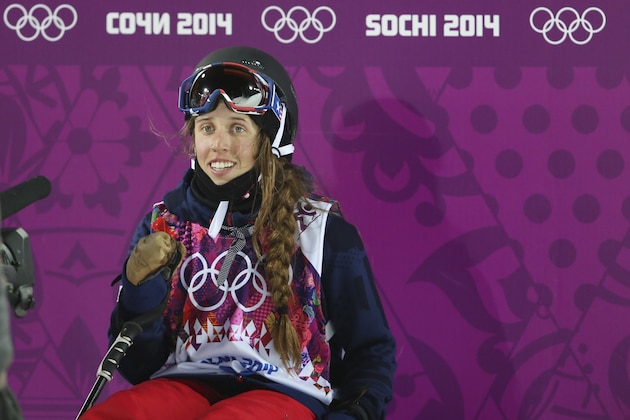 Maddie Bowman of the United States waits for her score after her first run in the women's ski halfpipe final at the Rosa Khutor Extreme Park, at the 2014 Winter Olympics, Thursday, Feb. 20, 2014, in Krasnaya Polyana, Russia. (AP Photo/Sergei Grits)