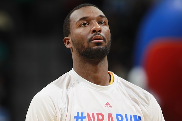 Denver Nuggets guard Jordan Hamilton warms up before facing the Milwaukee Bucks in the third quarter of the Nuggets' 110-100 victory in an NBA basketball game in Denver on Wednesday, Feb. 5, 2014. (AP Photo/David Zalubowski)