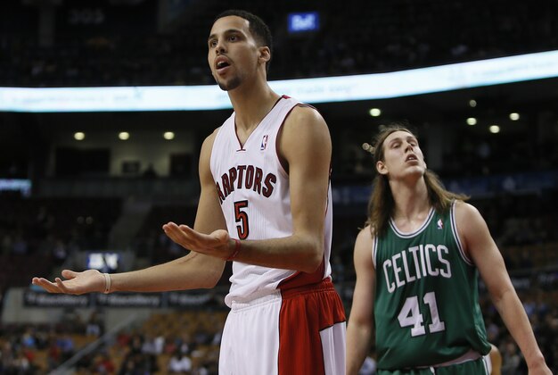 Oct 16, 2013; Toronto, Ontario, CAN; Toronto Raptors forward Austin Daye (5) reacts to a call as Boston Celtics forward Kelly Olynyk (41) looks on during the second half at Air Canada Centre. Toronto defeated Boston 99-97. Mandatory Credit: John E. Sokolowski-USA TODAY Sports