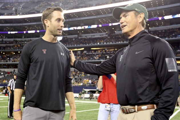 Texas Tech head coach Kliff Kingsbury, left, and Baylor head coach Art Briles  shake hands before an NCAA college football game in Arlington, Texas,  Saturday, Nov. 16, 2013. (AP Photo/LM Otero)