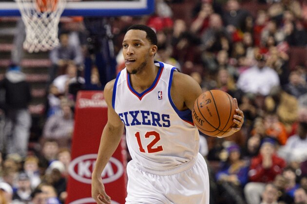 Feb 18, 2014; Philadelphia, PA, USA; Philadelphia 76ers guard Evan Turner (12) brings the ball up court during the third quarter against the Cleveland Cavaliers at the Wells Fargo Center. The Cavaliers defeated the Sixers 114-85. Mandatory Credit: Howard Smith-USA TODAY Sports