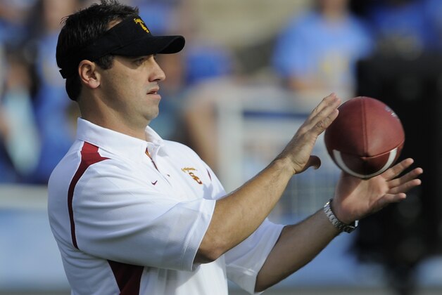 Southern California's assistant coach Steve Sarkisian watches the team warm up before their NCAA college football game against UCLA at the Rose Bowl in Pasadena, Calif., Saturday, Dec. 6, 2008.  (AP Photo/Chris Carlson)