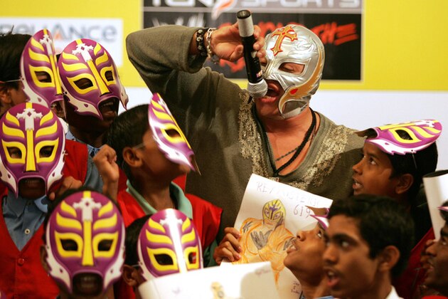 World Wrestling Entertainment star Rey Mysterio interacts with school children in Mumbai, India, Tuesday, March 13, 2007. Ray urged children to study and become good human beings. (AP Photo/Rajesh Nirgude)