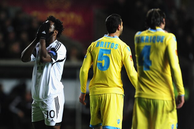 SWANSEA, WALES - FEBRUARY 20:  Swansea player Wilfried Bony reacts after a near miss during the UEFA Europa League Round of 32 first leg between Swansea City and SSC Napoli at Liberty Stadium on February 20, 2014 in Swansea, Wales.  (Photo by Stu Forster/Getty Images)