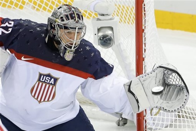 USA goaltender Jonathan Quick catches a shot on the goal during the first period of men's quarterfinal hockey game against the Czech Republic in Shayba Arena at the 2014 Winter Olympics, Wednesday, Feb. 19, 2014, in Sochi, Russia. (AP Photo/Matt Slocum)