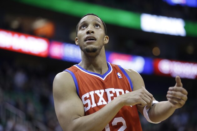 Philadelphia 76ers' Evan Turner (12) looks at the scoreboard in the second half of an NBA basketball game against the Utah Jazz Wednesday, Feb. 12, 2014, in Salt Lake City. (AP Photo/Rick Bowmer)