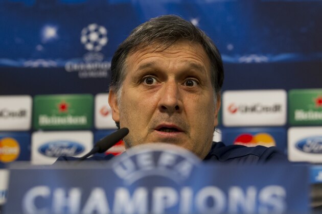 Barcelona's coach Gerardo Martino answers questions during a press conference at Manchester City's Etihad Stadium, Manchester, England, Monday Feb. 17, 2014. Barcelona will play Manchester City on Tuesday in a Champions League first knock out round soccer match. (AP Photo/Jon Super)