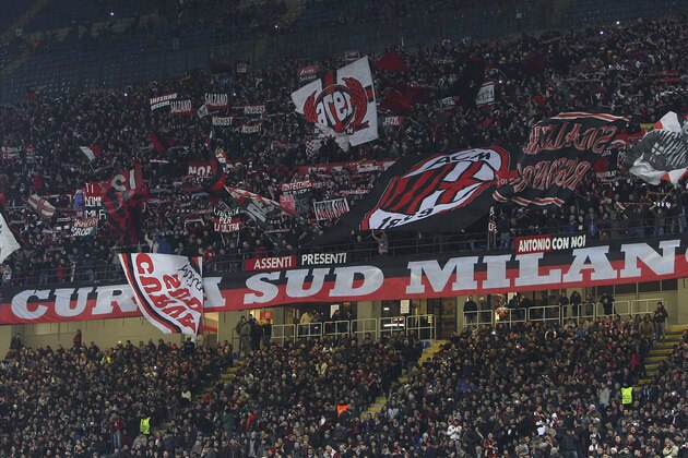 MILAN, ITALY - FEBRUARY 19:  The AC Milan fans show their support before the UEFA Champions League Round of 16 match between AC Milan and Club Atletico de Madrid at Stadio Giuseppe Meazza on February 19, 2014 in Milan, Italy.  (Photo by Marco Luzzani/Getty Images)