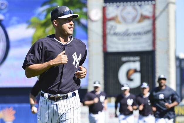 Feb 20, 2014; Tampa, FL, USA; New York Yankees infielder Derek Jeter (2) runs during warm ups for  morning practice at George M. Steinbrenner Field. Mandatory Credit: Tommy Gilligan-USA TODAY Sports