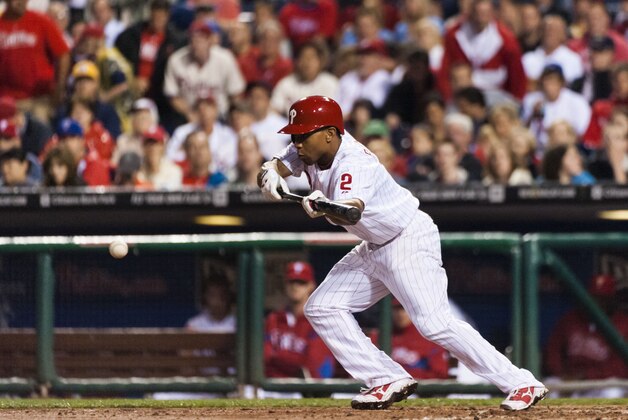 June 18, 2013; Philadelphia, PA, USA; Philadelphia Phillies center fielder Ben Revere (2) bunts for a single during the sixth inning against the Washington Nationals at Citizens Bank Park. The Phillies defeated the Nationals 4-2. Mandatory Credit: Howard Smith-USA TODAY Sports